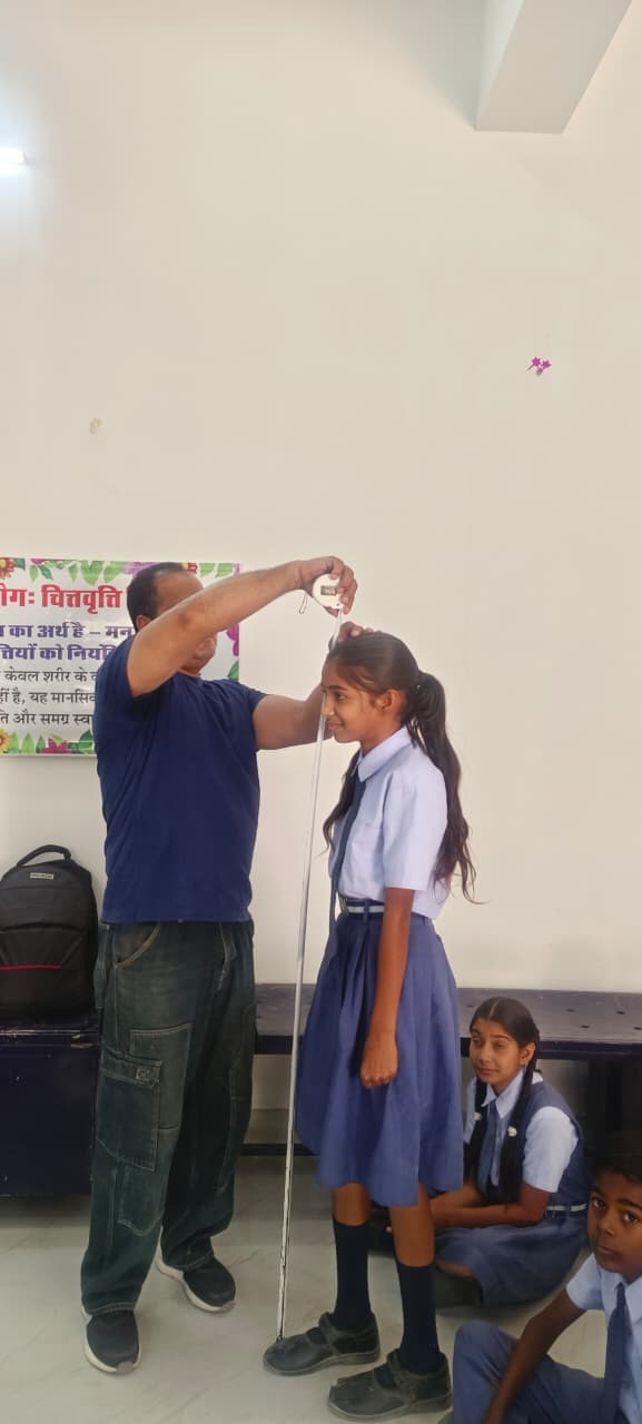 Height measurement during the screening — every student was measured